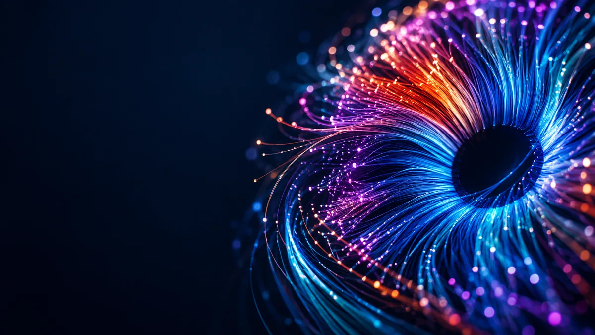 An abstract optical iris made of blue, violet and warm-red light fibres.